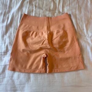 alphalete Amplify orange shorts